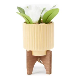White Floral Arrangement In Yellow Ridged Ceramic Pot With Stand
